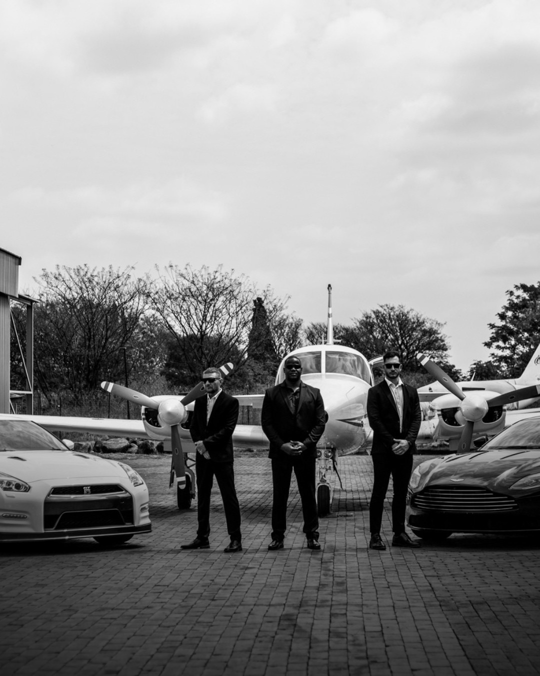 BI Protection three-man close protection team — aircraft and vehicles